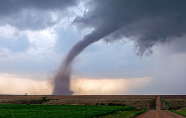 a tornado moving over an open field