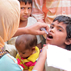 Photo during a campaign in India a child's pinkie finger is marked by a vaccinator signifying that polio vaccination was received.